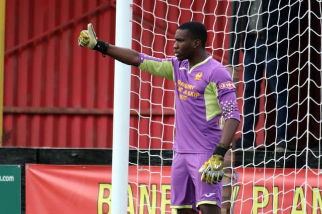 Banbury United keeper Manny Agboola is clear to play in Saturday's Buildbase FA Trophy tie