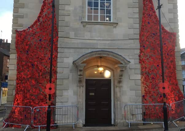 Brackley Town Hall has been decorated with cascades of poppies for the Armistice centenary NNL-180711-122858001