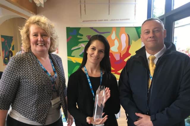 (L-R) Horton facilities manager Denise Pawley, hospitality manager Leeann Grant with the award and estates manager Keith Byrom