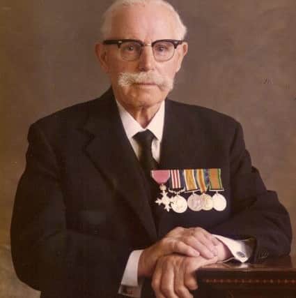 Sidney Woodcock in his later years with his war medals. Photo: Steve Woodcock NNL-180811-094432001
