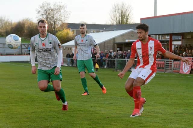 Brackley Town's Luke Fairlamb gets in a cross against Blyth Spartans. Photo: Jake McNulty
