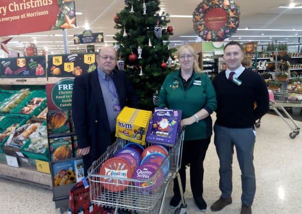 BYHP trolley dash, Partick Vercoe, BYHP CEO, Mandy Merry, Morrisons' community chapion and store manager Mike Freeman NNL-181211-132130001