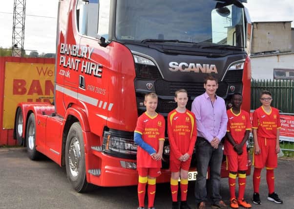 Banbury Plant Hire Director Nathan Matthews with some of the Banbury United youth players in their new shirts