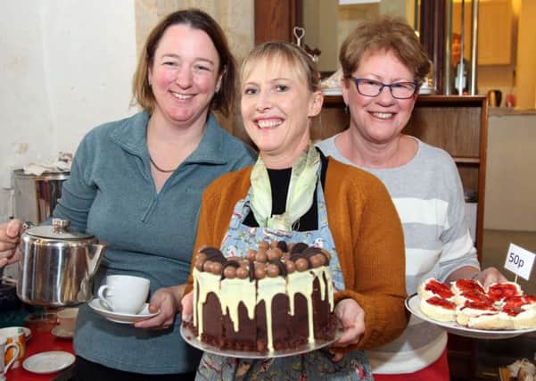 Susannah Lomelle, Janeen Wilson and Judith Bassett serving coffee and cake NNL-180411-205956009