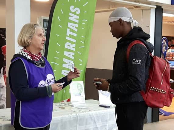 Banbury Samaritans volunteer Davina Birkbeck chats to a commuter about the Small Talk Saves Lives campaign. Photo: Samaritans