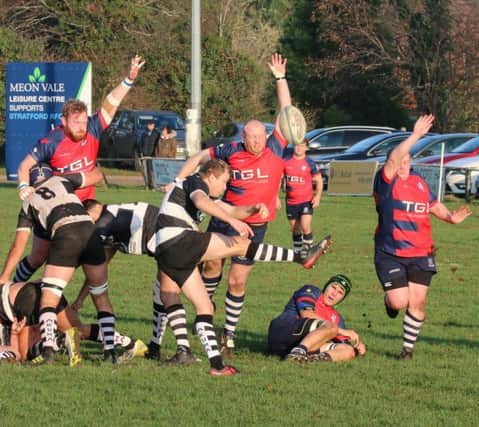 Chris Phillips tries to charge down a clearing kick during Banbury Bulls' victory at Stratford. Photo: Simon Grieve