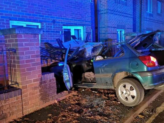 The wreckage of the car which crashed into the wall on Britannia Road, Banbury. Photo: Oxfordshire Fire and Rescue Service