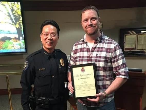 Mitch Mellott (right) being presented with his Chief Superintendent's Commendation by Federal Way's Chief of Police Andy Hwang