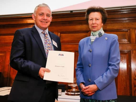 The Princess Royal and Graeme Castle having presented him his lifetime commitment award. Photo: Paul Wyeth/RYA