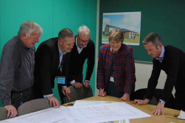 Councillors are shown the plans for The Hill by the developers. (L-R) Cllr Barry Richards, Steve Keynes from Edgar Taylor, Clive Williams from Williams Architects, Cllr Lynn Pratt and Andy Couves from Sport England. Photo: Cherwell District Council