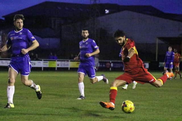 Banbury United's  Ravi Shamsi runs at the Lowerstoft Town defence during Saturday's stalemate. Photo: Steve Prouse