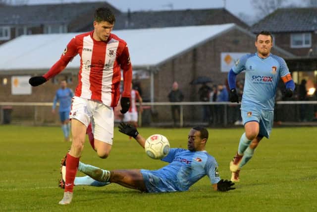 Brackley Town's Liam McAlinden gets the better of Hayes & Yeading United's Ed Asafu-Adjaye on his debut. Photo: Jake McNulty