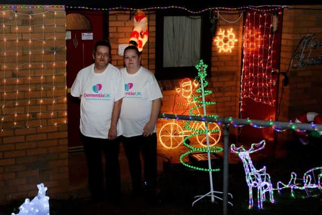 Carla and Darren Cooper from Banbury, who have lit up their house for Christmas, in aid of Dementia UK NNL-181112-224257009