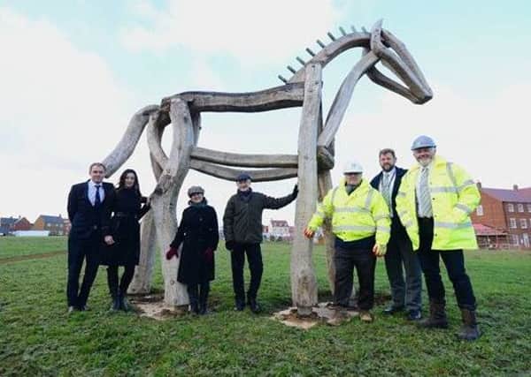Bellway sales advisor Mark Brooks, sales manager Elaine Brown, Arts Office Paula Bailey, artist Philip Bews, Bellway project manager Alan Lee, Ashberry sales advisor James Padden and site manager Chris Jones. A new piece of public art, called The Horse, has been unveiled at the Hanwell View and Cherry Fields developments in Banbury. NNL-181219-103816001