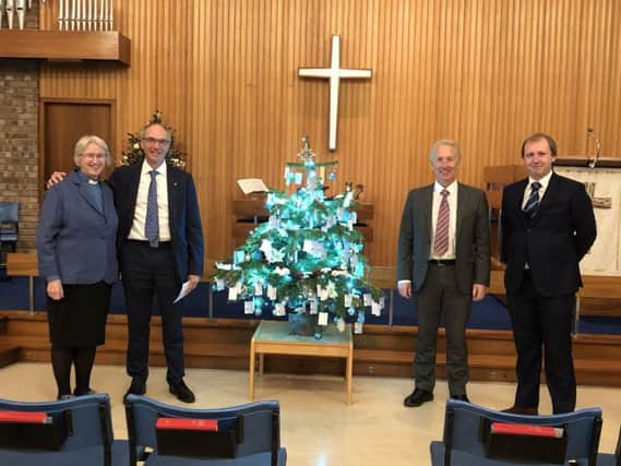Humphris Family Funeral Directors organised a carol service in the Marlborough Road Chapel before Christmas. Left to right, Reverend Jean Fletcher, Martin Humphris, Chris Humphris and his son Matthew Humphris. NNL-181219-121834001