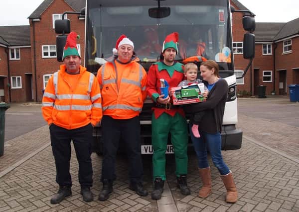 Billy gets presented a toy bin lorry from the Cherwell recycling crew NNL-181218-160044001