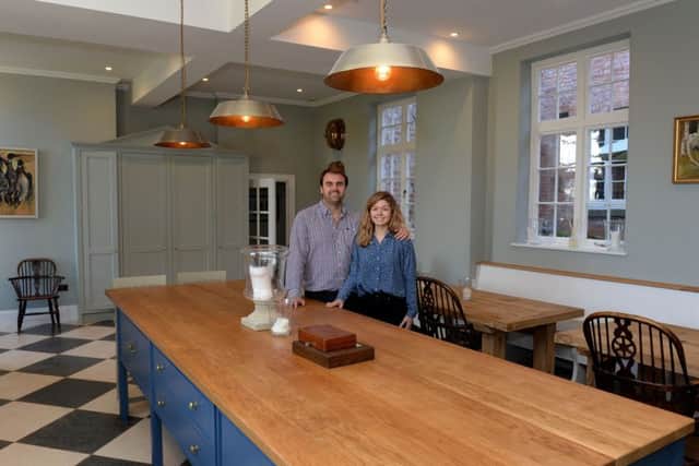 Thorpe Manor, Thorpe Mandeville, renovations. Henry and Natasha Teare in the kitchen featuring more bespoke furniture NNL-190801-131641009