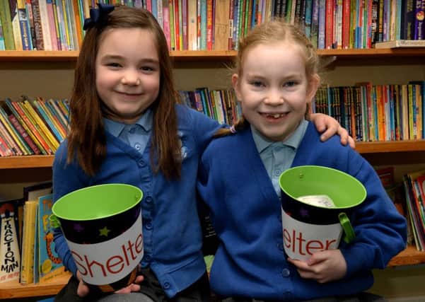 Honour Nolan, left, and Alannah Butler-McLees, from Holy Trinity Catholic School, Chipping Norton, raised money for Shelter NNL-190115-150659009