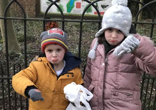 Bella Camilleri, seven, and her brother Leo, four, with the bagfuls of rubbish they collected at Adderbury Lakes. Photo: Tanya Camilleri NNL-190115-123153001
