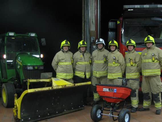 Chipping Norton firefighters with the donated tractor and plough. Photo: Chipping Norton Town Council
