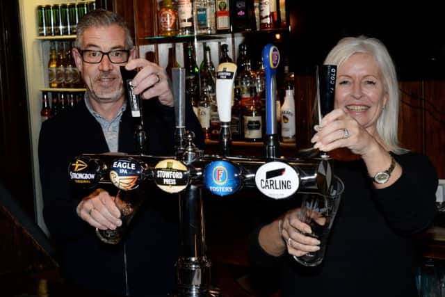 Dave and Gail behind the bar at The Banbury Cross