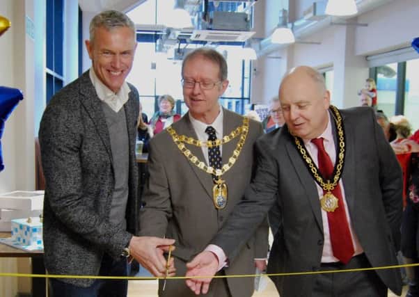 Mark Foster (centre left) cuts the ribbon with help from South Northamptonshire Council chairman Cllr Richard Dallyn (centre), Brackley mayor Mark Morrell (centre right)