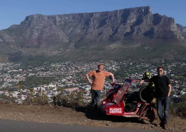 Matt Bishop and Reece Gilkes reach Table Top mountain, South Africa with their moped and sidecar combo NNL-181016-160543001