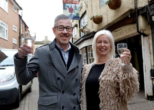 Cheers! Gail and Dave Gilkes celebrate taking over The Banbury Cross pub on Butchers Row