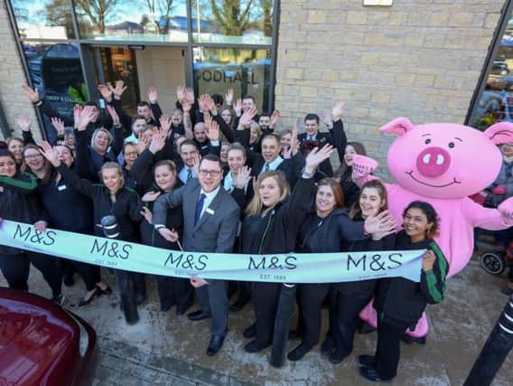 Staff celebrate as store manager Lewis Tea cuts the ribbon to open the new M&S Foodhall in Chipping Norton. Photo by Anna Lythgoe/Grayling PR