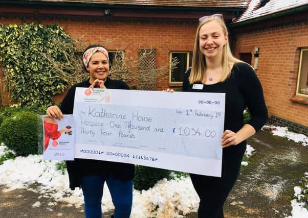 Carley Ashley hands over a cheque to  Mandy Bray of KHH after sales of her Calendar Girls calendar NNL-190502-091723001