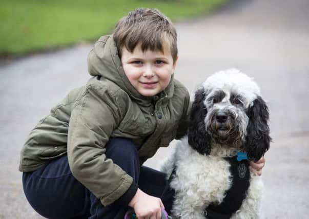 Ollie Lister and Snoopy, who is a Childs Hero finalist of this years Friends for Life competition, organised by the Kennel Club.( copyright BeatMedia.) NNL-190802-112613001
