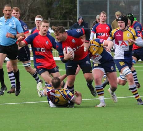 Banbury Bulls' player-coach Matt Goode is tackled at Oxford Harlequins shortly before being injured. Photo: Simon Grieve