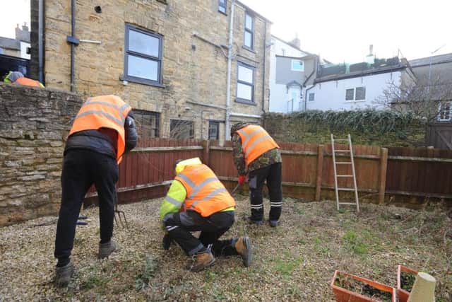 Community service workers make improvements to the hostel garden NNL-191102-142709001