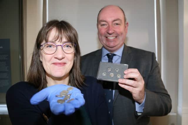 Warwickshire County Council curator of human history Sara Wear with Cllr David Reilly and more Roman coins NNL-190219-155014001