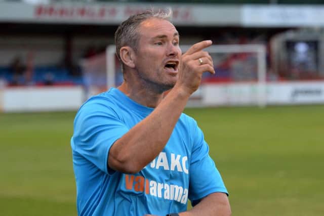 Brackley Town manager Kevin Wilkin has extended his contract