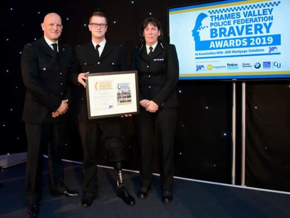 PC Tom Dorman receiving his award from Thames Valley Police Federation Chairman Craig OLeary and Thames Valley Polices Assistant Chief Constable Nikki Ross