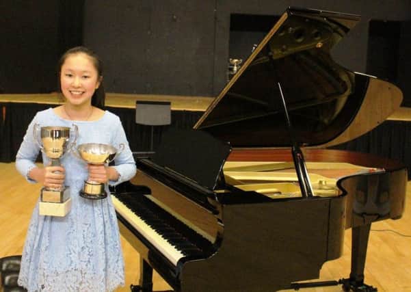 Banbury Young Junior Musician of the Year 2018  Amelie Chen with trophies NNL-181202-133609001