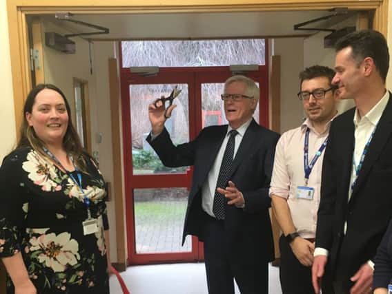 John Craven cuts the ribbon at the Horton General Hospital's new integrated services hub with (L-R) Kathy Hall, director of strategy, head of therapies Terry Cordrey and director of improvement John Drew