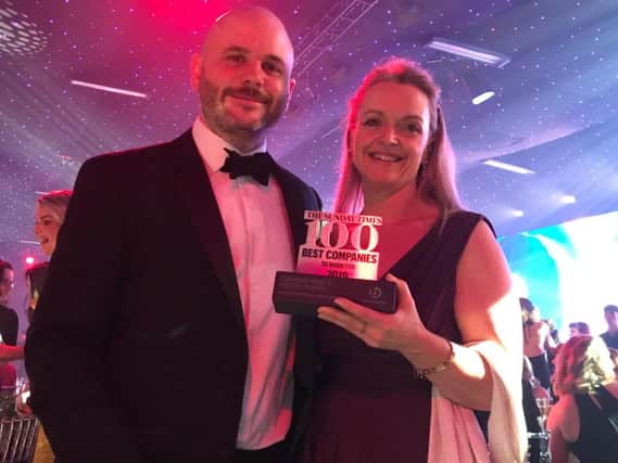 Oakman Inns' Ops Director Alex Ford & HR Director Jill Scatchard celebrate at Sunday Times Best Companies to Work For 2019