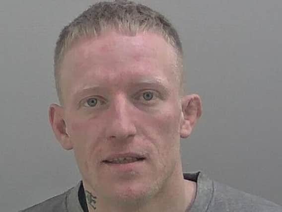 James Cooper, 33, is wanted on recall to prison. Photo: Warwickshire Police