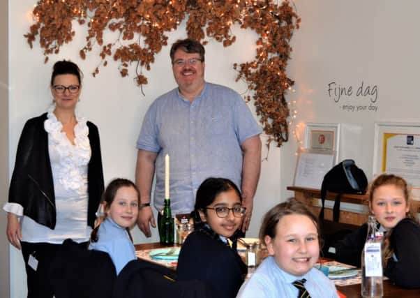 Ilja Abbattista, owner of Little Amsterdam with Tim Tarby Donald of Visit Banburuy and St John's Priory School students NNL-190103-160110001