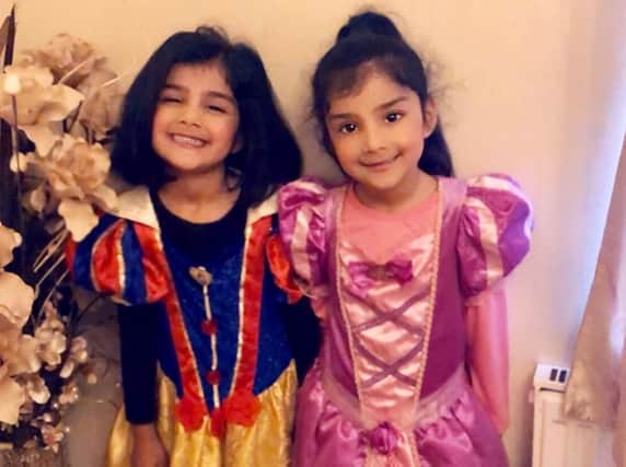 Twin sisters Malaikah and Medina, aged 4, pupils at St Leonards School Nursery, dressed as Snow White and Rapunzel.
.