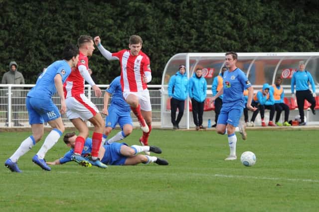 Brackley Town's Jimmy Armson is thwarted against Stockport County. Photo: Jake McNulty