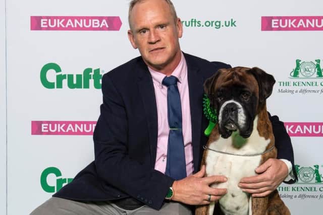 Mitch Griffiths with his champion Boxer dog, Dave
