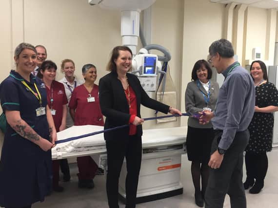 Oxford University Hospitals NHS Foundation Trust chief executive Bruno Holthof cuts the ribbon with (L-R) radiology staff, Victoria Prentis MP, Oxfordshire Clinical Commissioning Group chief executive Lou Patten, and trust director of strategy Kathy Hall. Photo: OUH