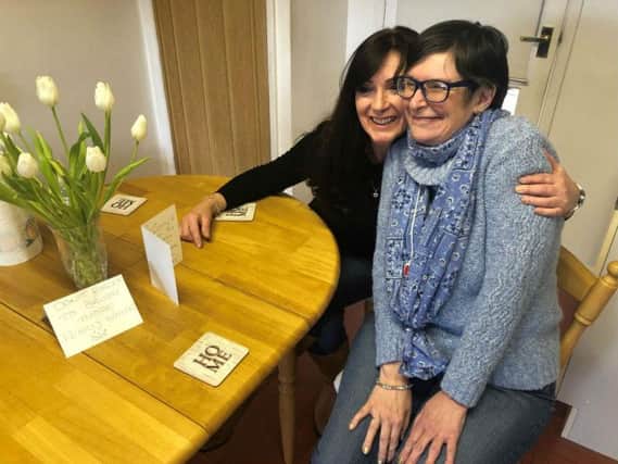 Tracey Jennings and her sister-in-law Jo with some of the reminders she leaves. Photo: Oxfordshire County Council