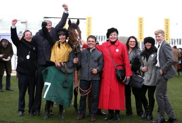 Trainer Ben Case and jockey Kielan Woods with Croco Bay and his winning connections at the Cheltenham Festival