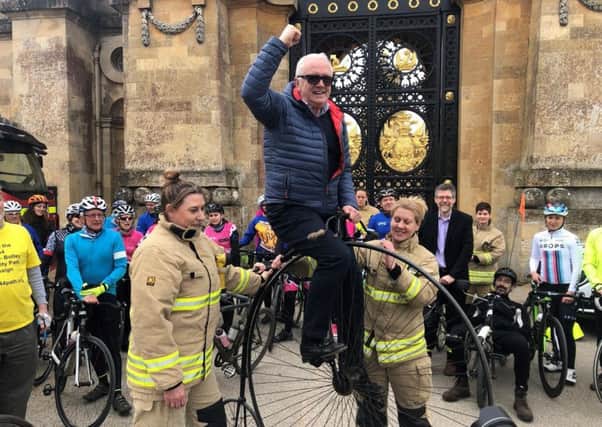 Women's Tour organiser Mick Bennett celebrating on a penny farthing at the Blenheim Palace launch event. Photo: Oxfordshire County Council NNL-190320-113042001