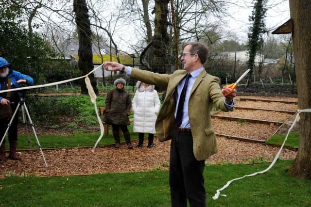 Swalcliffe Community Woodland Play Park opening. Neil Urquhart, chaiman of Swalcliffe Parish Council, cuts the ribbon. NNL-191203-144917009