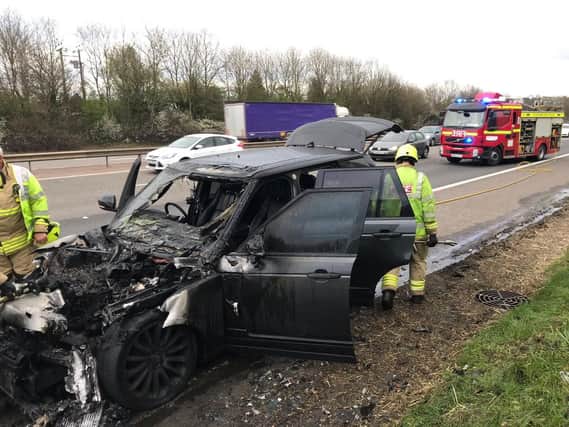 The charred remains of the car which caught fire on the M40 near Banbury. Photo: Thames Valley Police